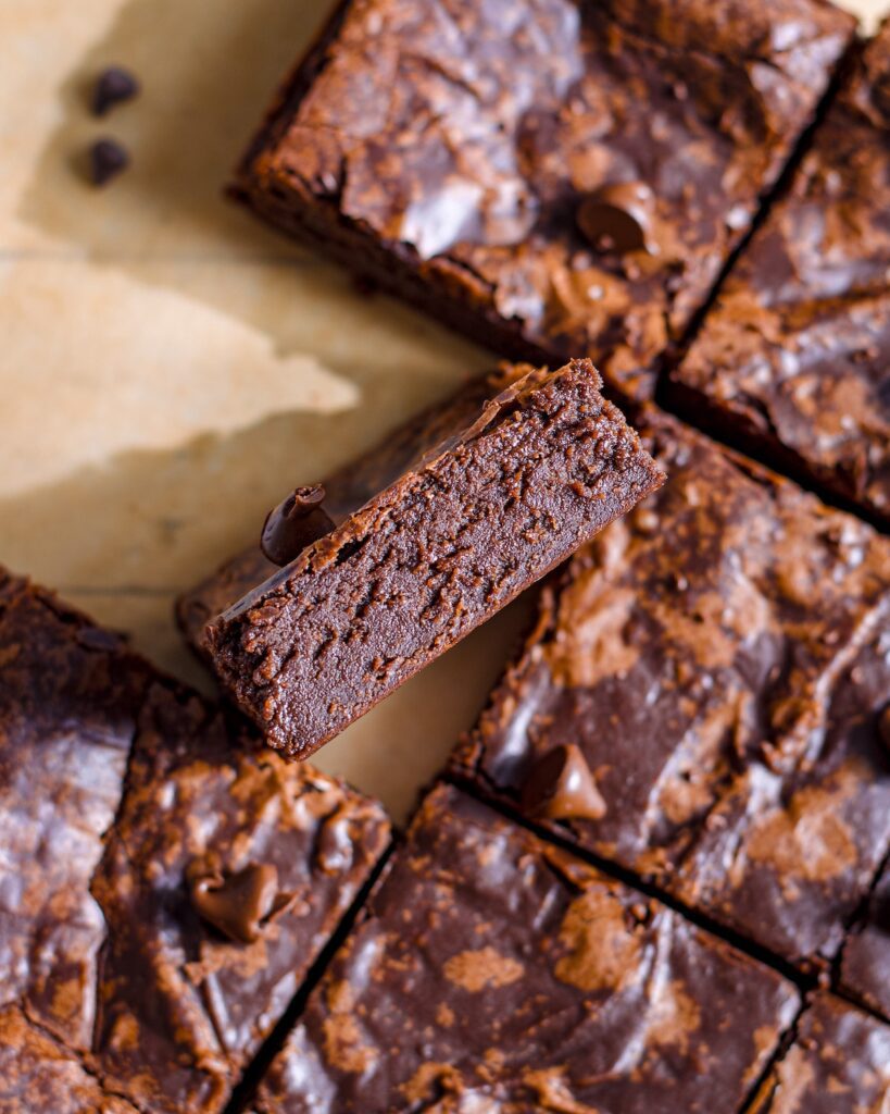 Eggless and vegan Chocolate Brownies within shiny crinkle crust