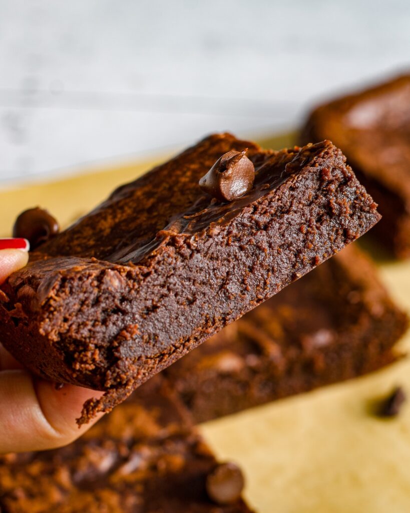 Eggless and vegan Chocolate Brownies within shiny crinkle crust