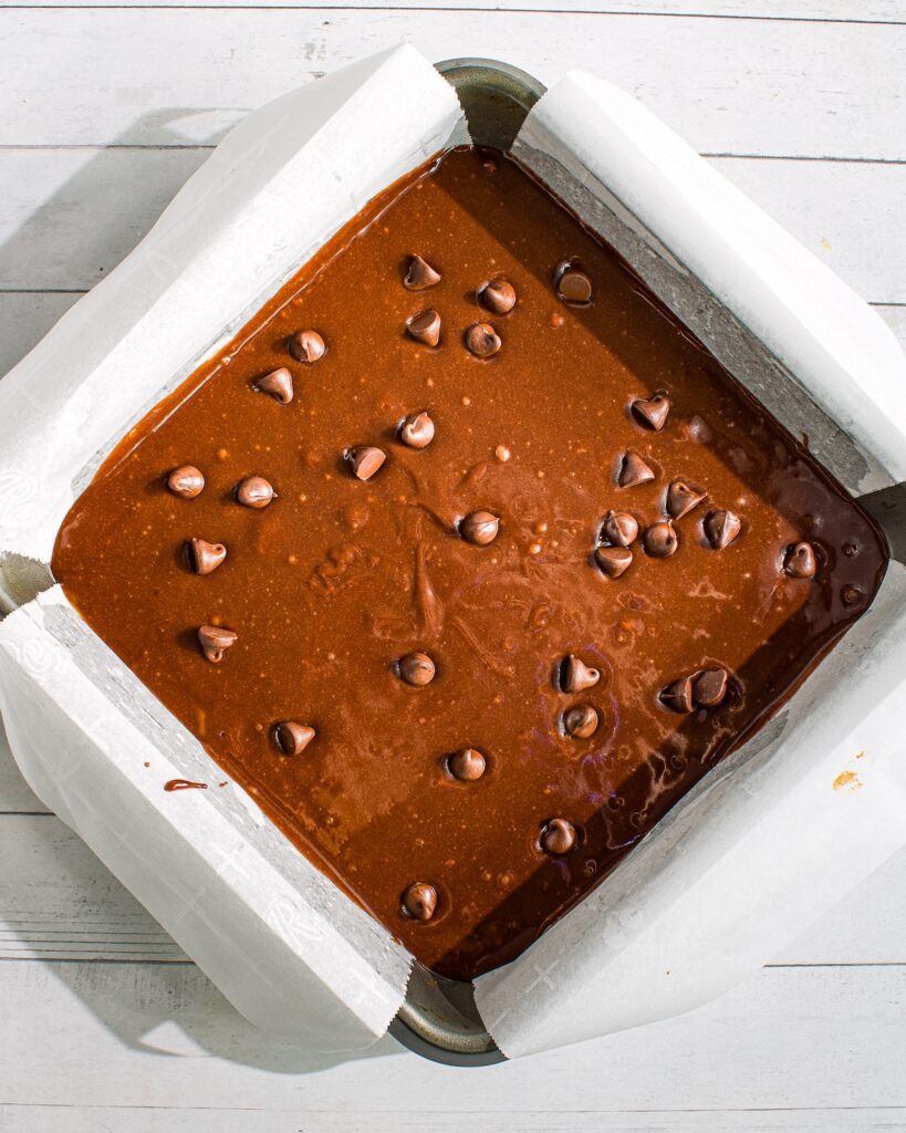 Eggless and vegan Chocolate Brownies within shiny crinkle crust