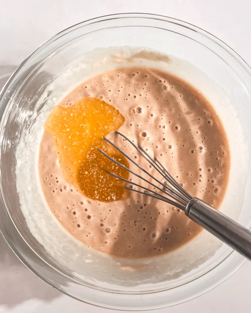 3 mixing dry and wet ingredients for eggless cake