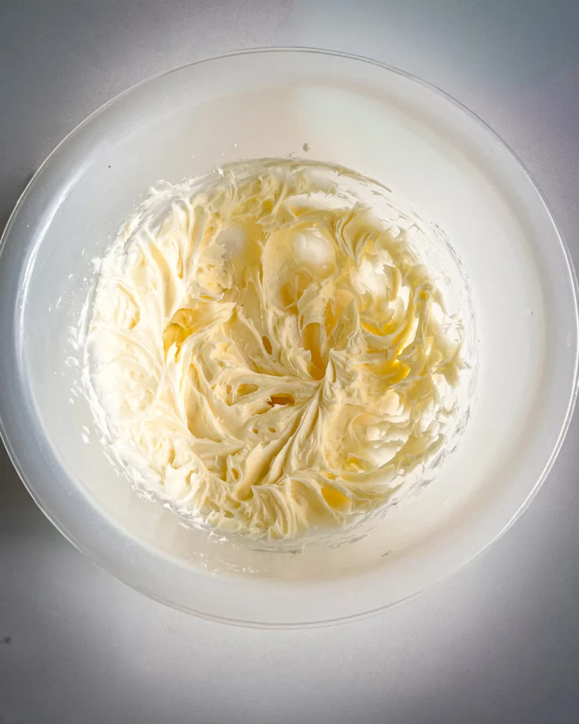 Jam Filled Butter Cookies step by step by mixing butter with powder sugar