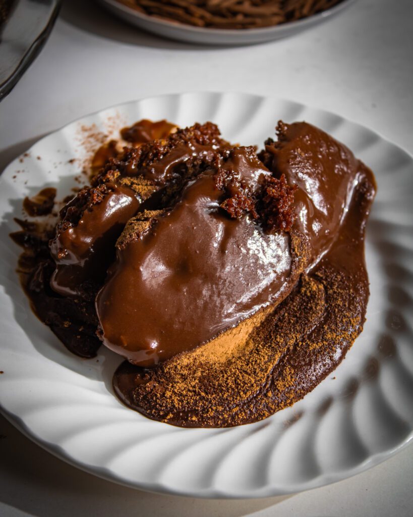 moist fudgy Eggless Chocolate Pudding Cake recipe on a plate