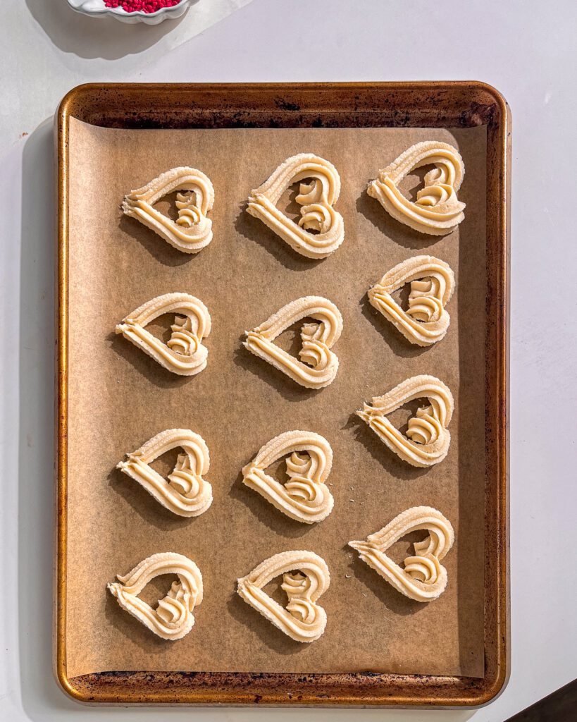 Heart-shaped chocolate-dipped butter cookies arranged for gifting