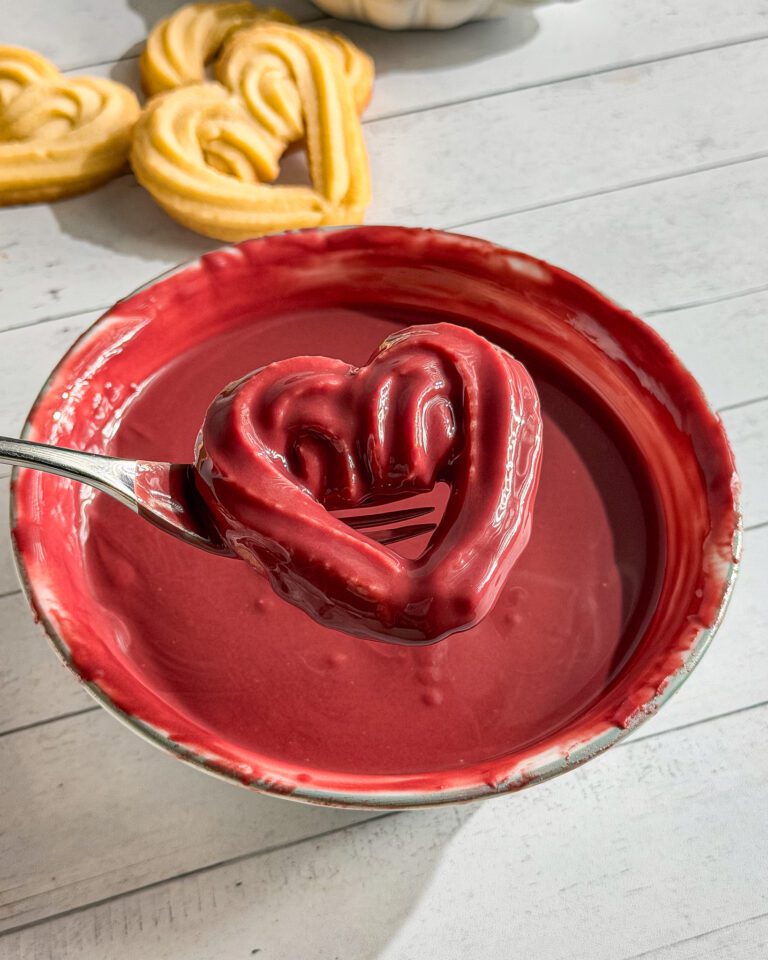 Red Chocolate-dipped heart-shaped cookies for Valentine’s Day
