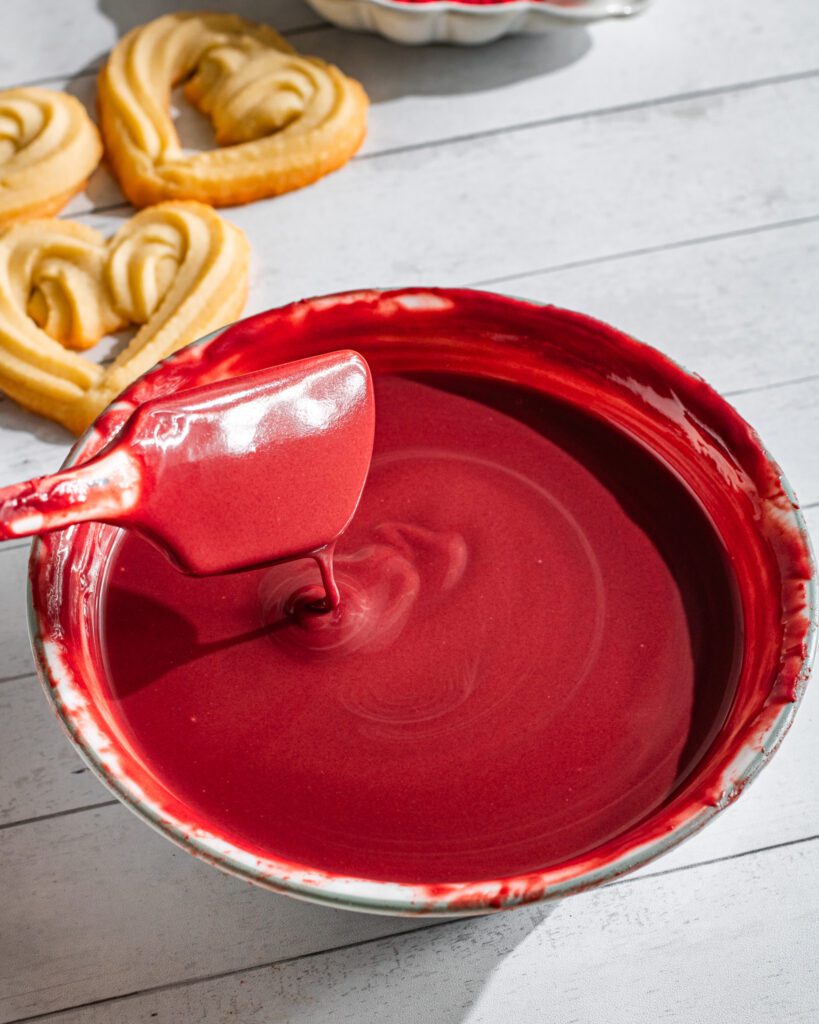 Red Chocolate-dipped heart-shaped cookies for Valentine’s Day