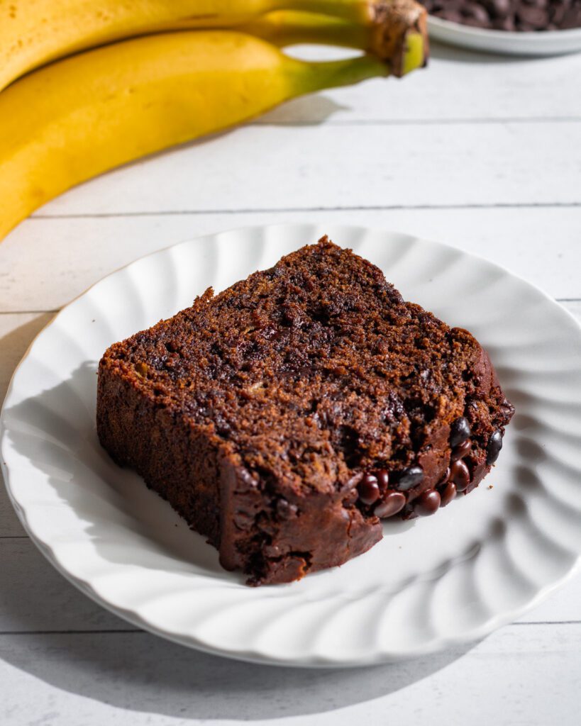 chocolate banana bread sliced on a plate