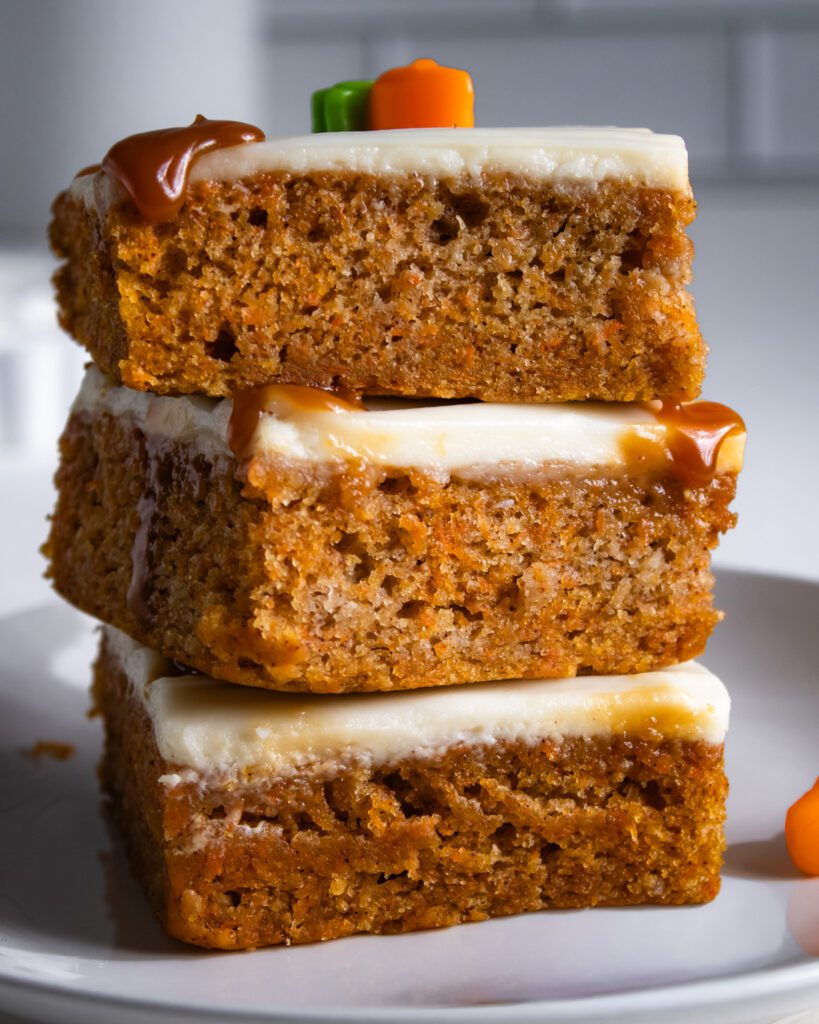 moist vegan and eggless carrot cake slice on plate