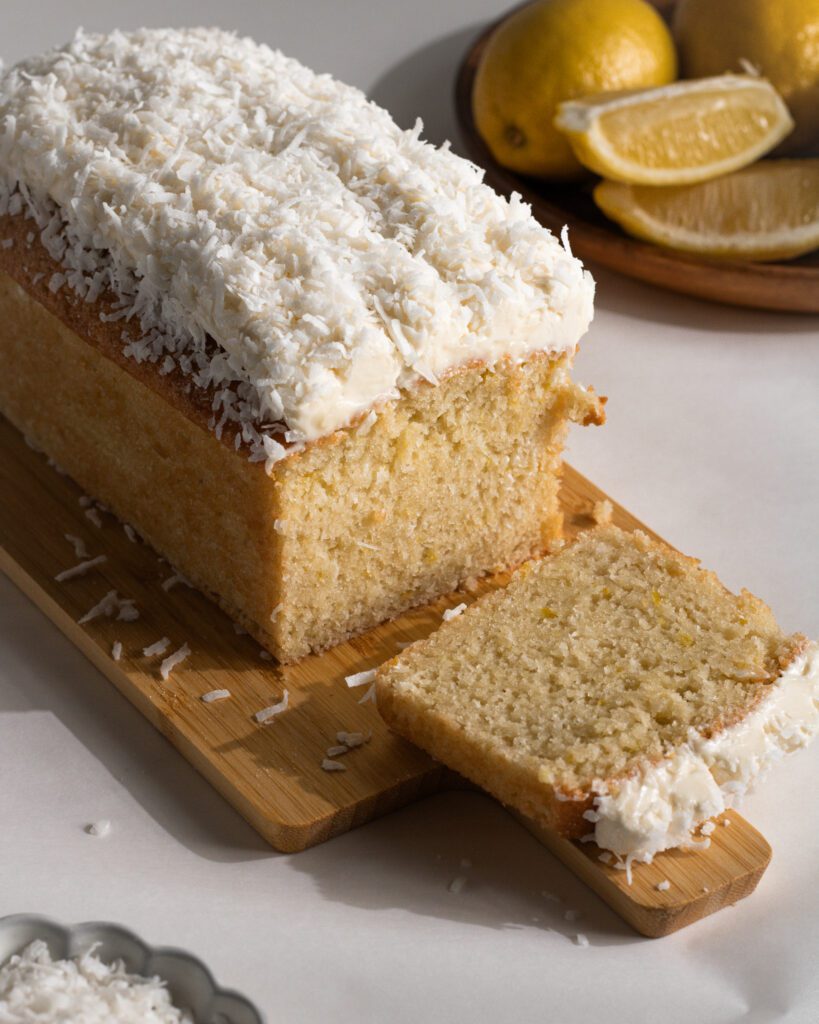 Bakery-style lemon coconut loaf cake with fluffy frosting