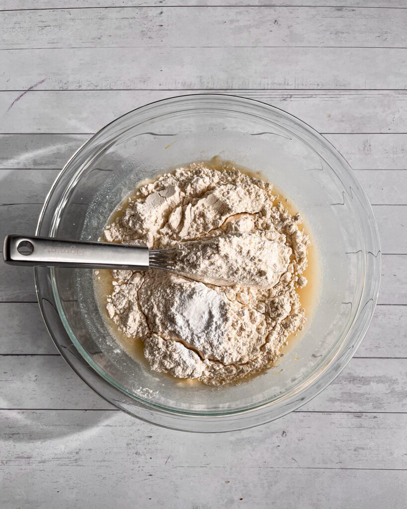 Mixing dry ingredients for eggless lemon coconut loaf cake
