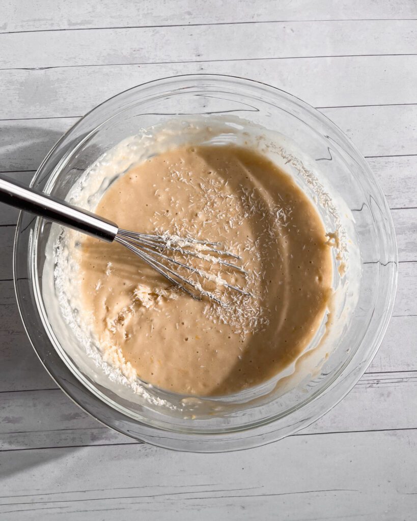 Mixing smooth lemon coconut cake batter