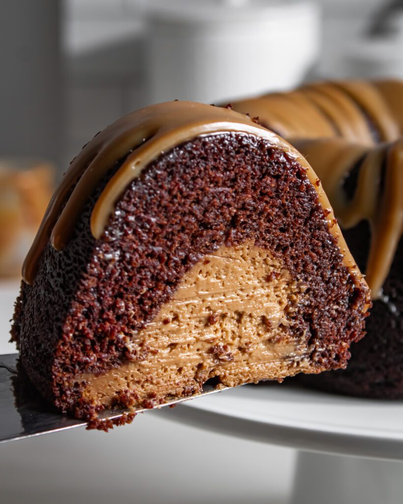 Slice of eggless and vegan chocolate coffee cake showing soft crumb